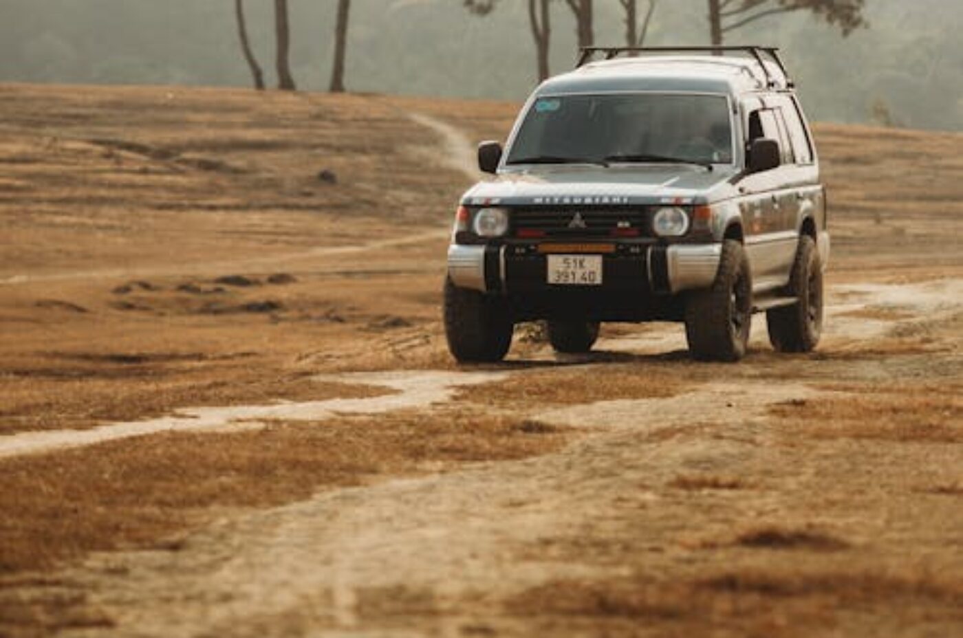 4WD SUV on dirt road in Africa