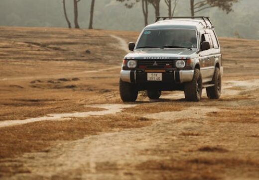 4WD SUV on dirt road in Africa