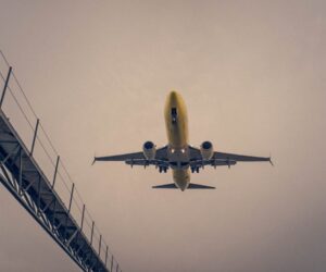 Airplane flying in blue sky