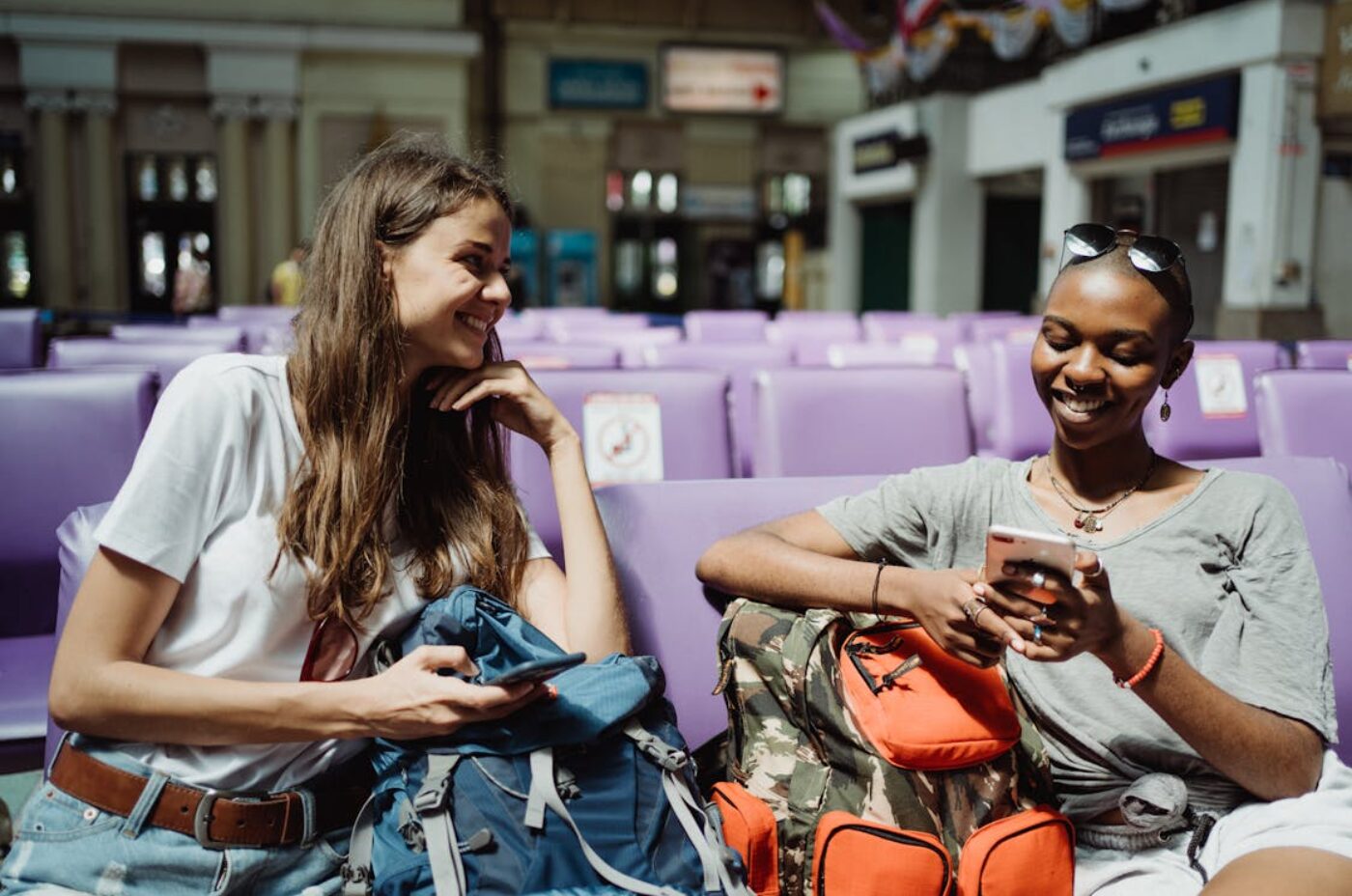 Women travelers with backpacks in a city — Madagascar travel safety tips