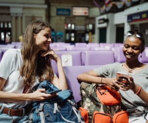 Women travelers with backpacks in a city — Madagascar travel safety tips