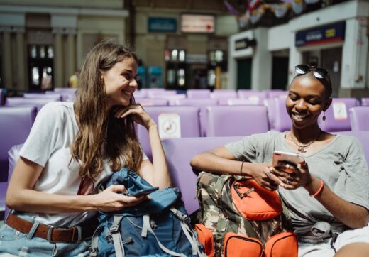 Women travelers with backpacks in a city — Madagascar travel safety tips