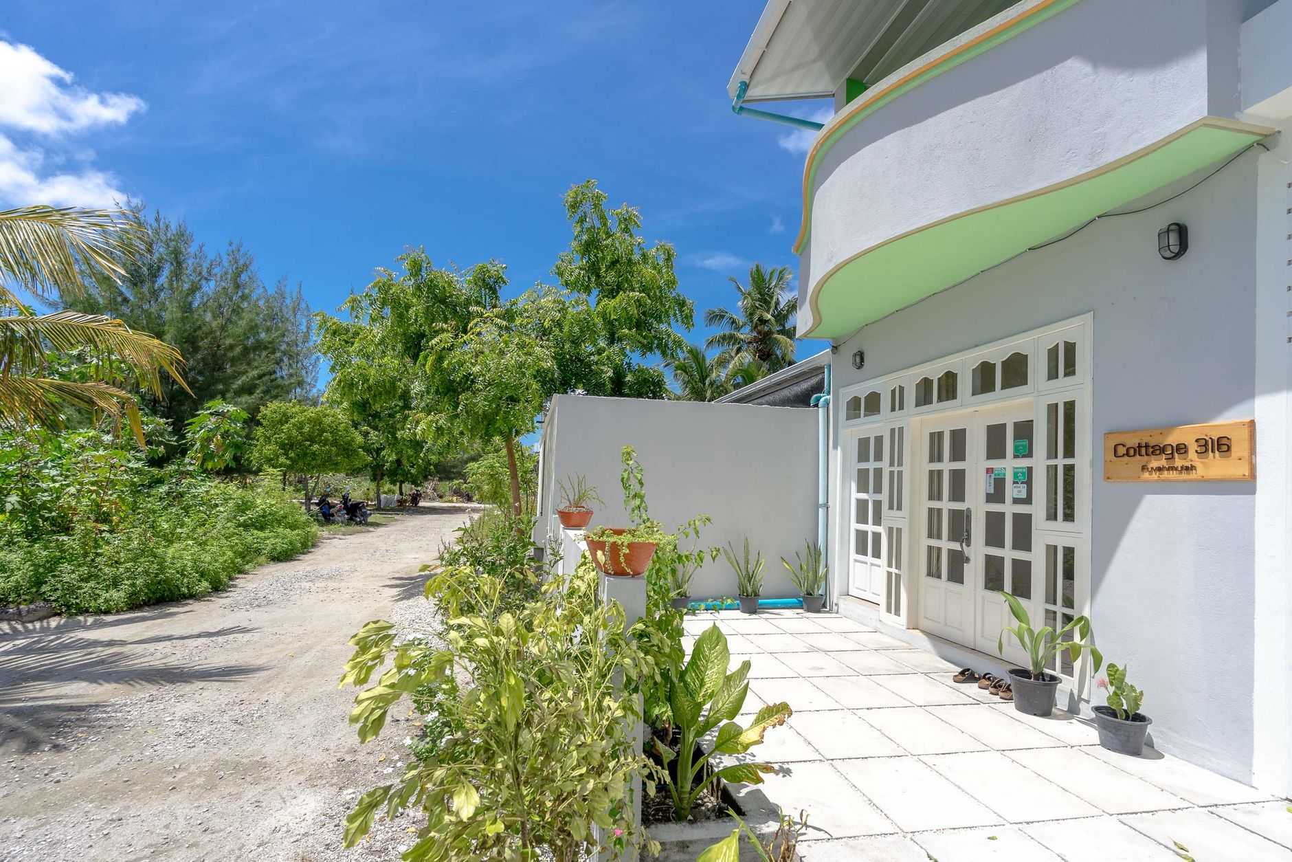 Tropical island guesthouse bungalow surrounded by lush greenery — Madagascar