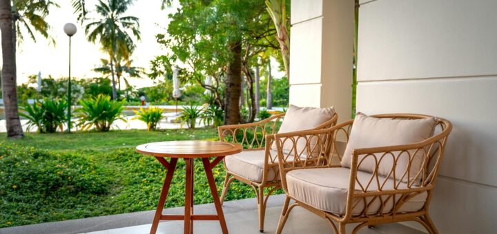 Cozy guesthouse patio with rattan chairs and tropical garden Antananarivo