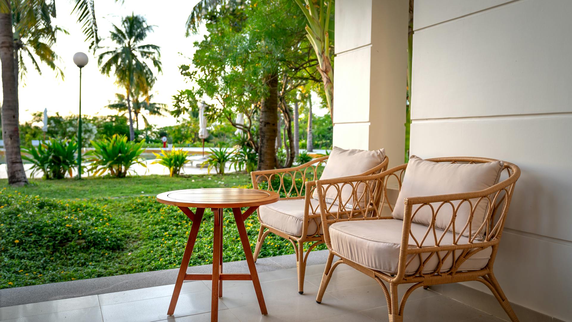 Cozy guesthouse patio with rattan chairs and tropical garden Antananarivo