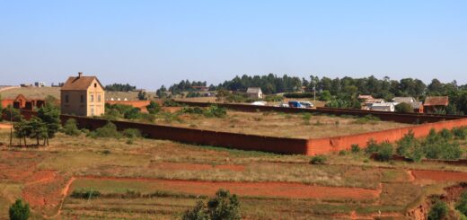 Rural highland village with a red-earth house, Madagascar